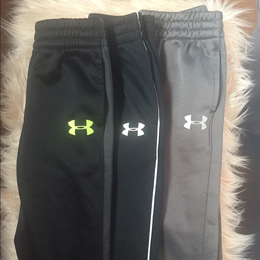 Three pairs of under armour boys pants
